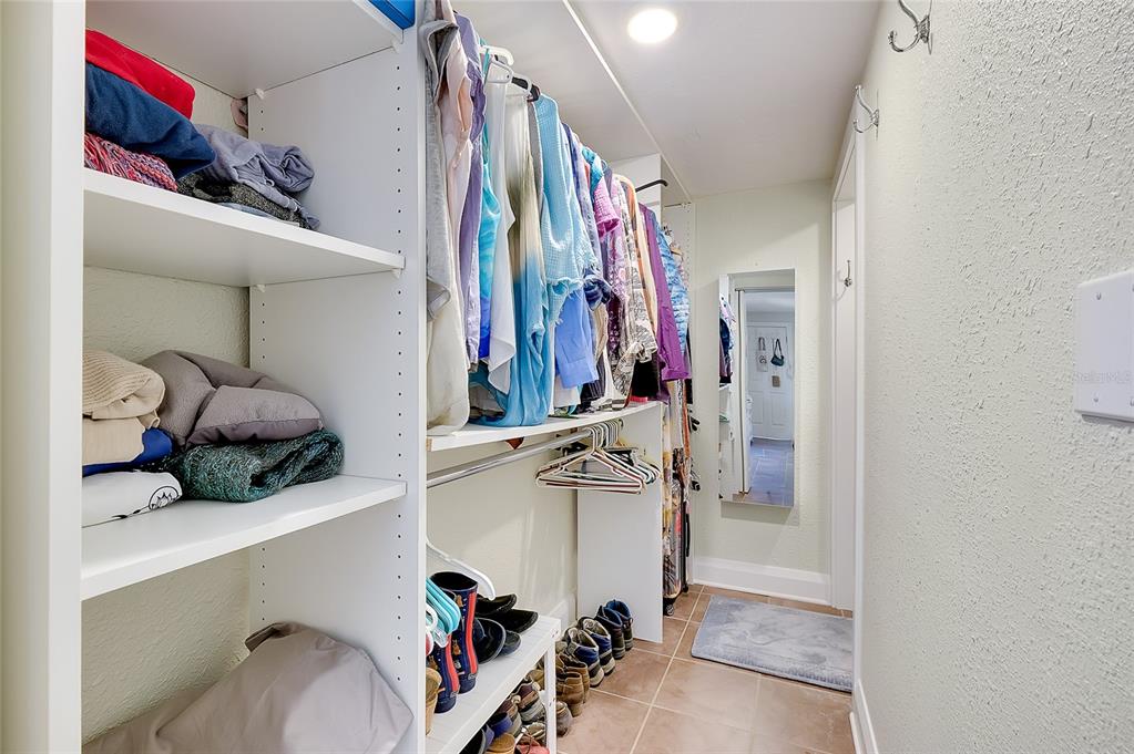 223 Palmetto Road West Nokomis, FL 34275 - Photo 39 of 100 a view of walk in closet with clothes and shoes