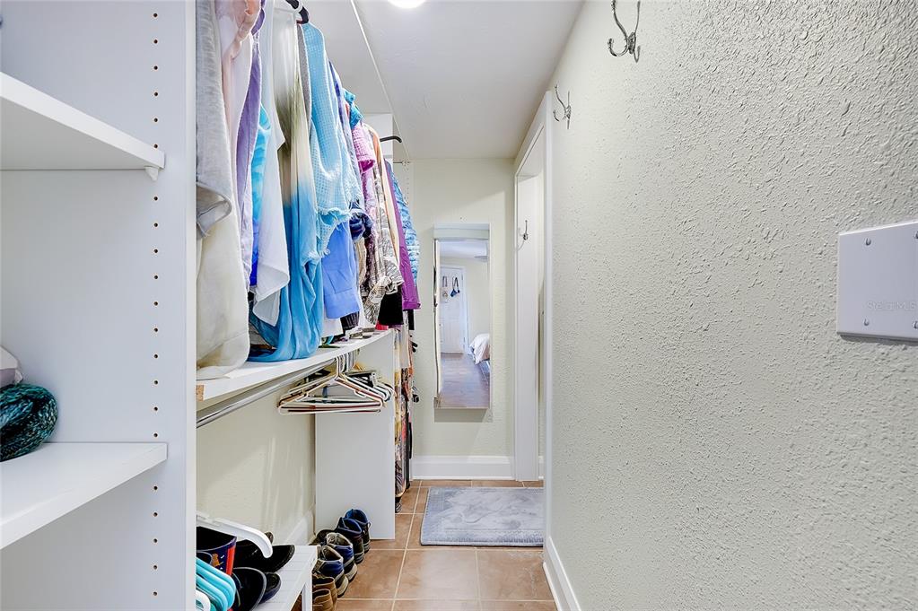 223 Palmetto Road West Nokomis, FL 34275 - Photo 40 of 100 a view of walk in closet with clothes and shoes