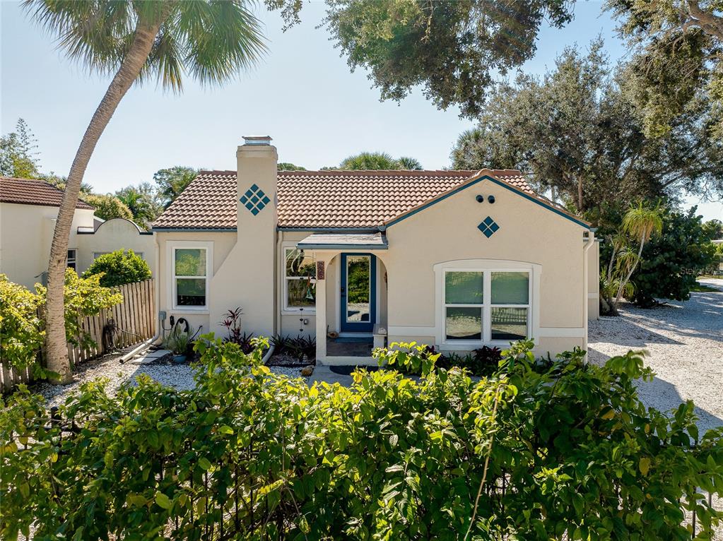 223 Palmetto Road West Nokomis, FL 34275 - Photo 4 of 100 front view of a house with a yard