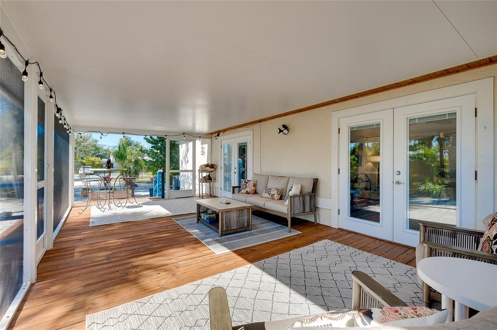 223 Palmetto Road West Nokomis, FL 34275 - Photo 56 of 100 a outdoor space with patio the couches and a dining table with garden view