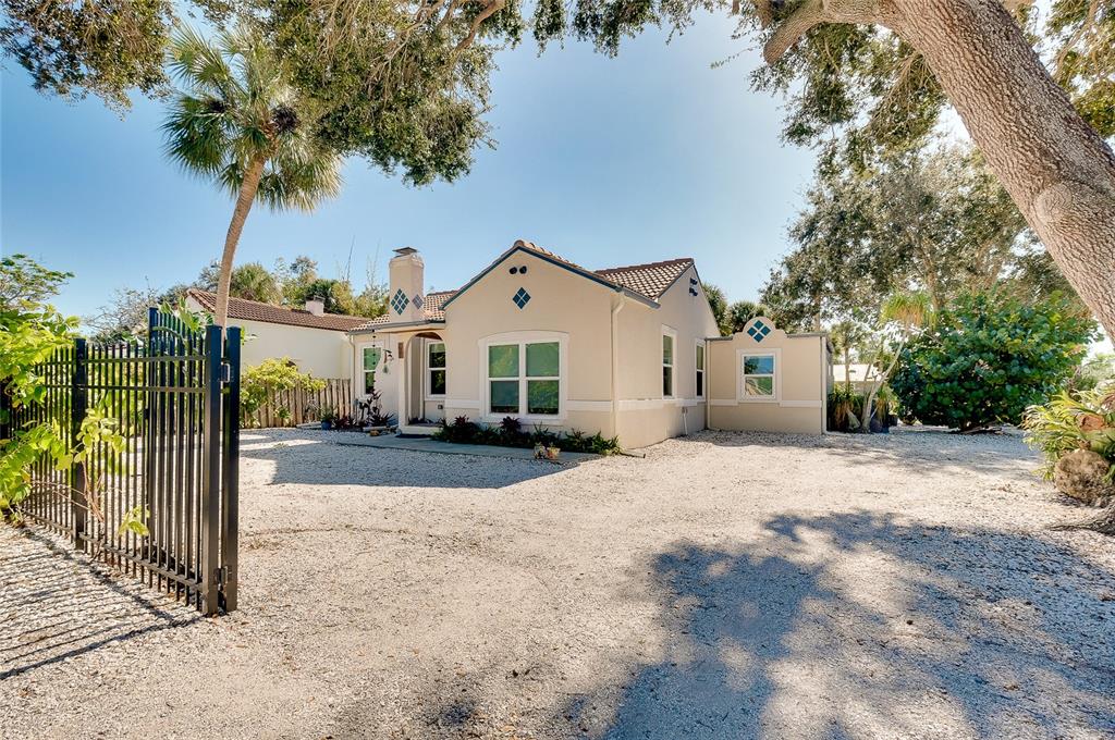 223 Palmetto Road West Nokomis, FL 34275 - Photo 78 of 100 a front view of a house with a yard and garage