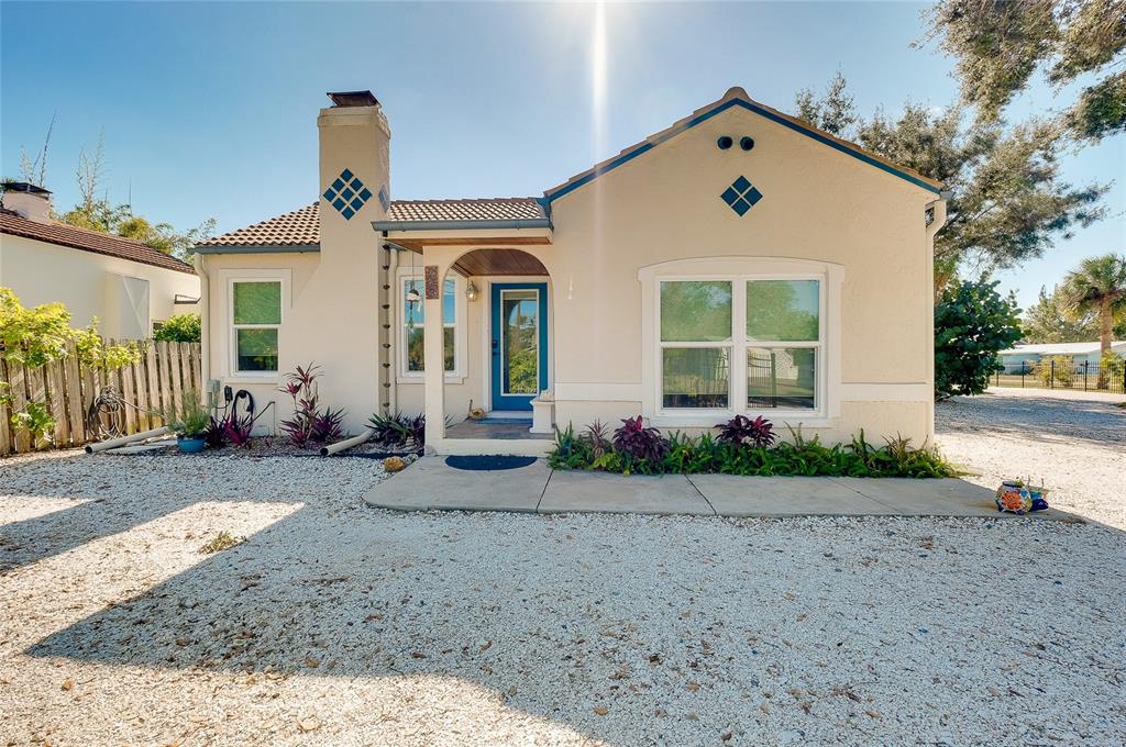 223 Palmetto Road West Nokomis, FL 34275 - Photo 82 of 100 a front view of a house with garden