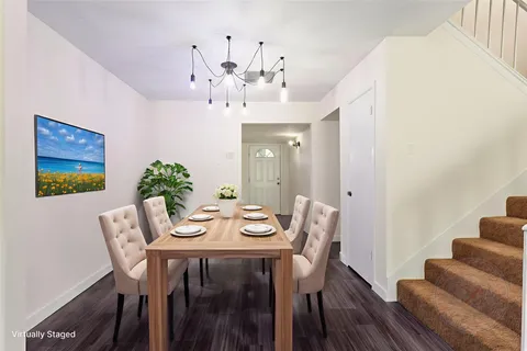 an empty room with closet and windows