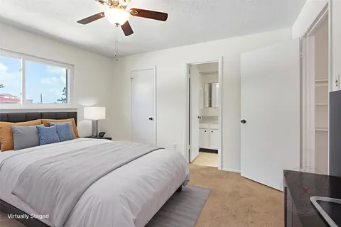 a bedroom with bed and window