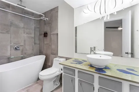 a bathroom with a sink a toilet and a bathtub