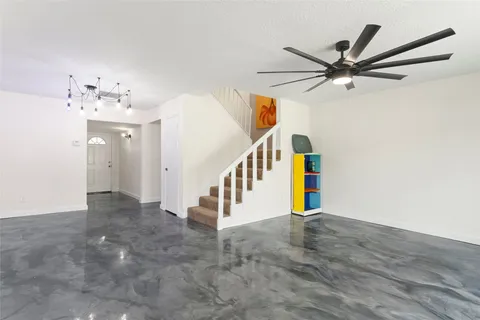 a kitchen with stainless steel appliances a sink stove and cabinets
