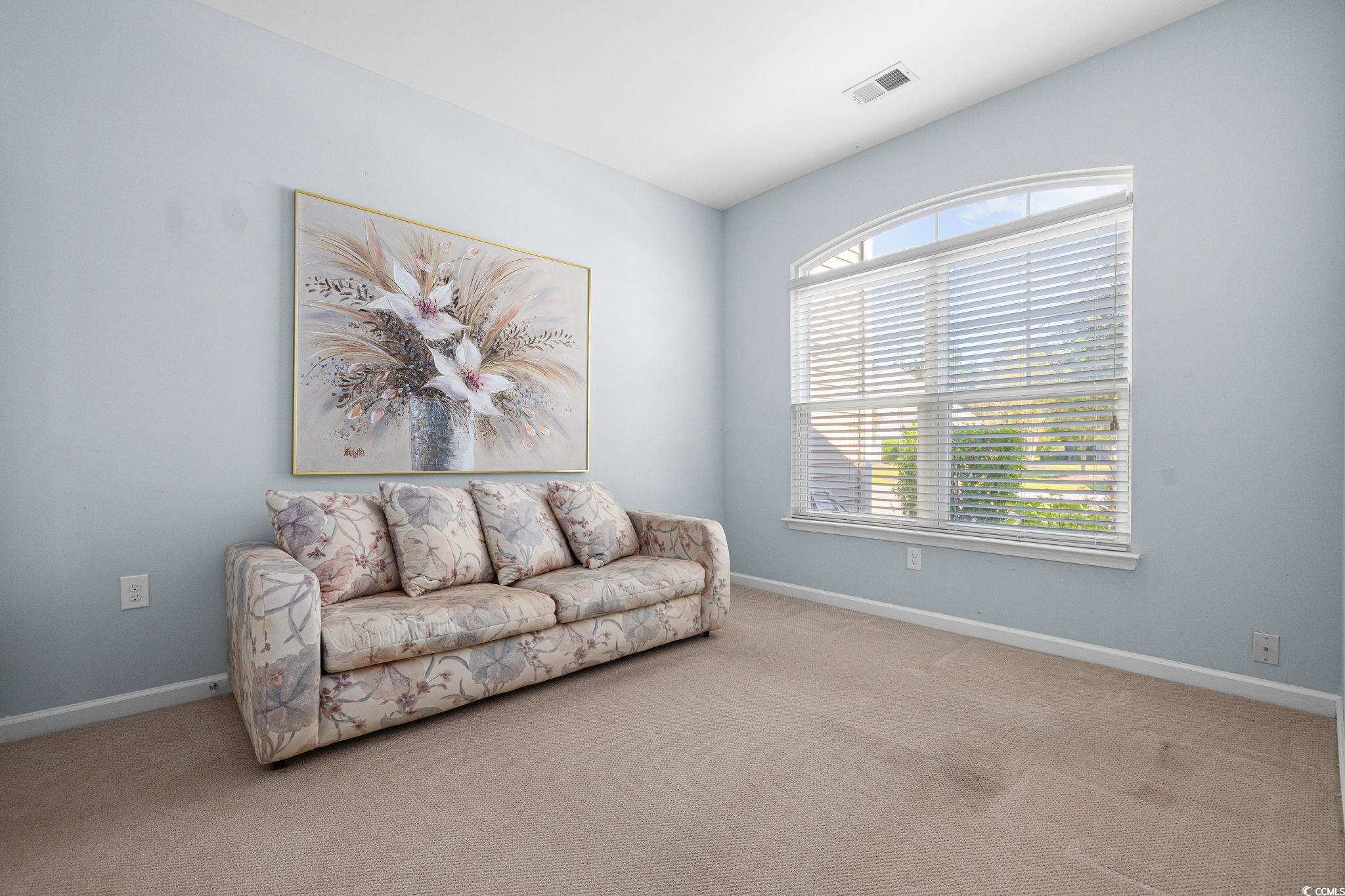 817 Arezzo Way, Unit 1001 Myrtle Beach, SC 29579 - Photo 27 of 40 Living area featuring light carpet and baseboards