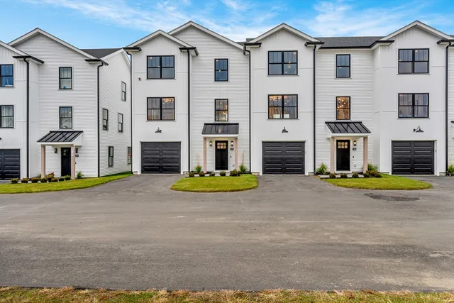 a view of a house with backyard and swimming pool