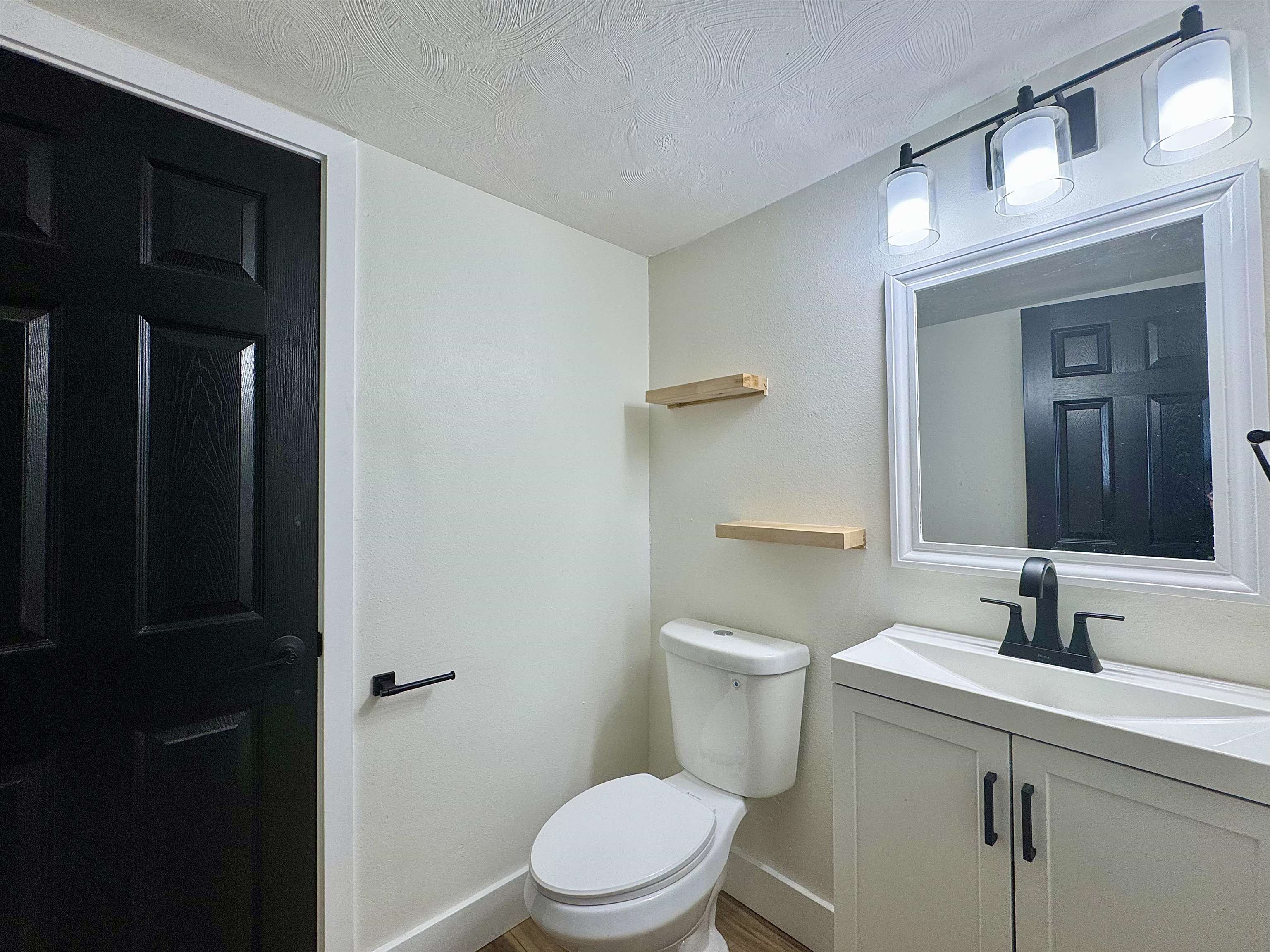 111 Kahului Beach Road, Unit D321 Kahului, HI 96732 - Photo 17 of 22 a bathroom with a sink a toilet a mirror and vanity
