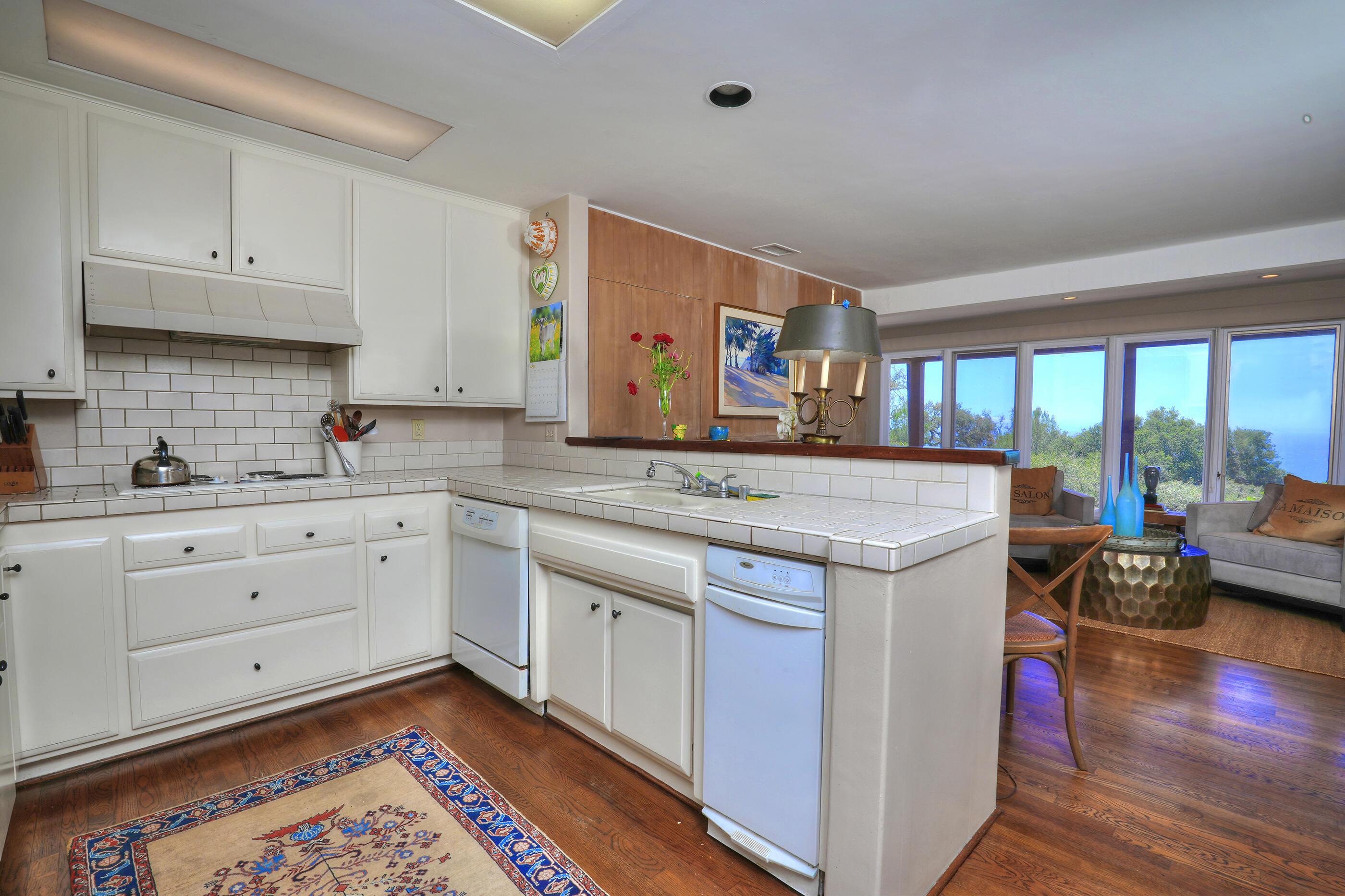 1986 Arriba Street Carpinteria, CA 93013 - Photo 12 of 35 a open kitchen with stainless steel appliances granite countertop a stove and cabinets