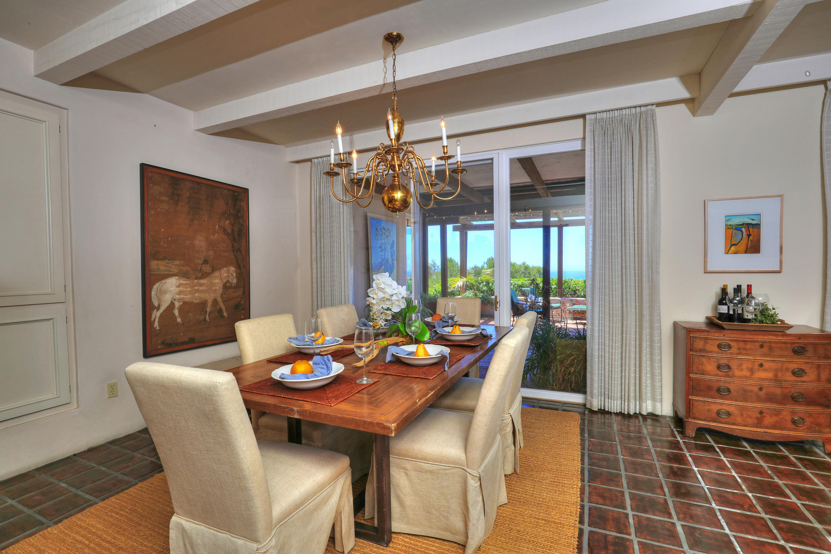 1986 Arriba Street Carpinteria, CA 93013 - Photo 16 of 35 a view of a dining room with furniture wooden floor and chandelier