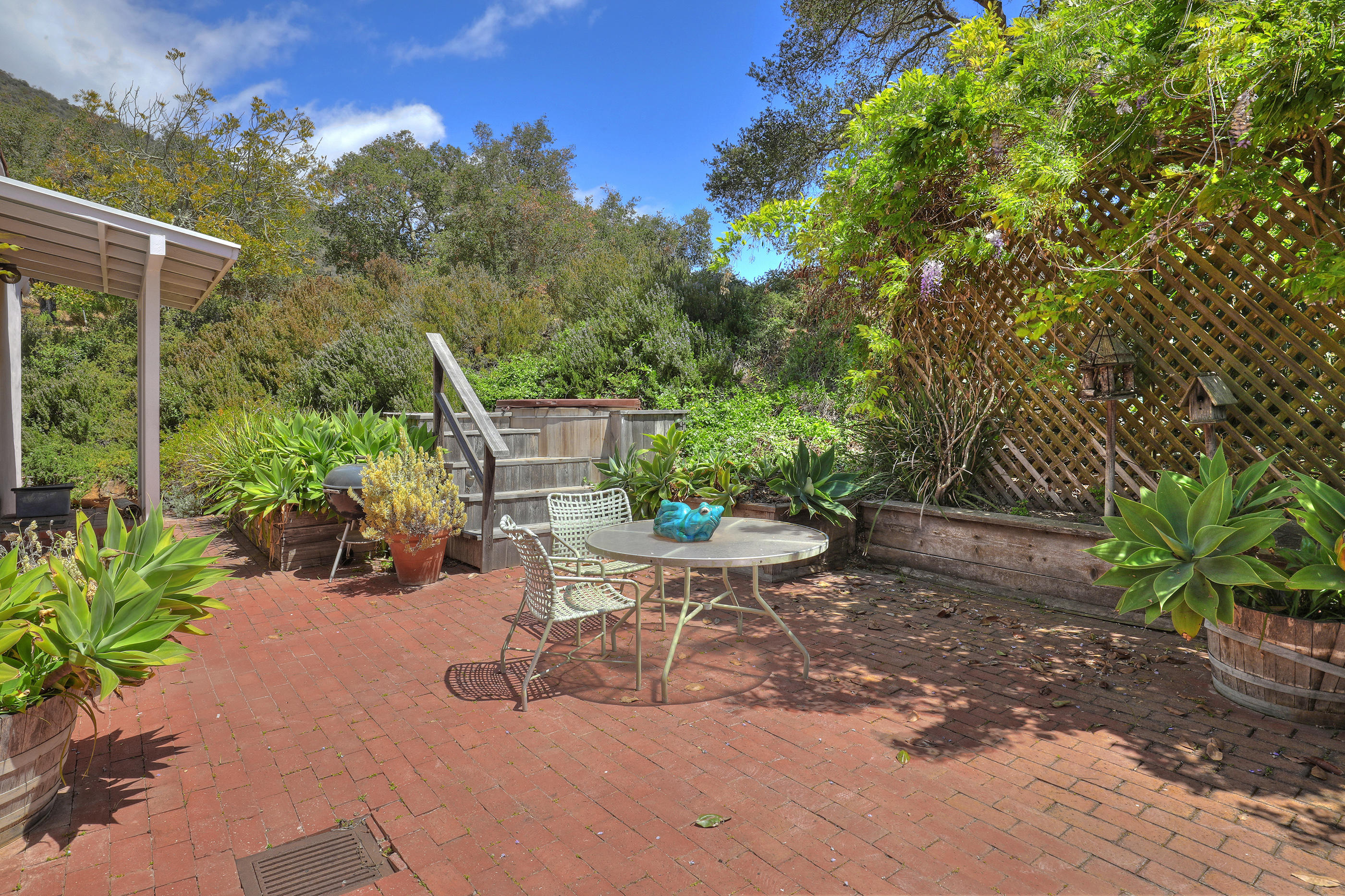 1986 Arriba Street Carpinteria, CA 93013 - Photo 20 of 35 a view of a backyard with plants and a patio
