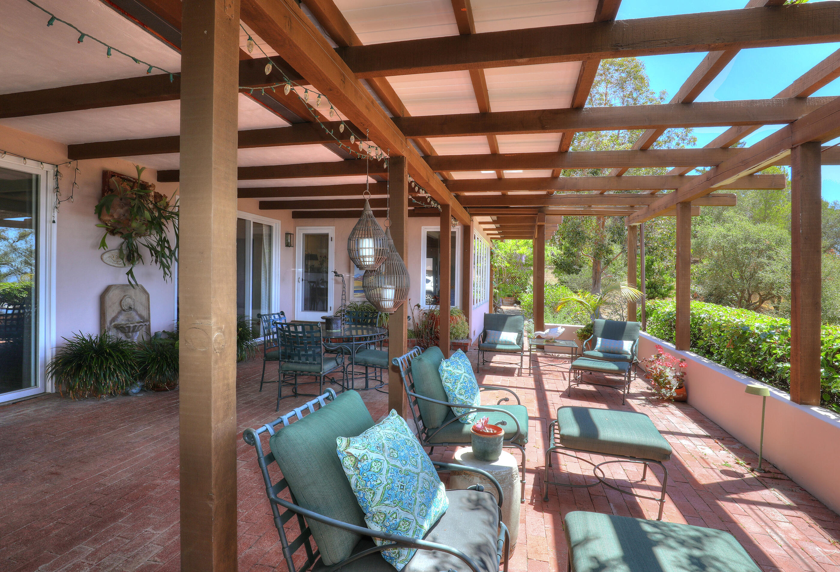 1986 Arriba Street Carpinteria, CA 93013 - Photo 26 of 35 a view of a porch with furniture and a yard