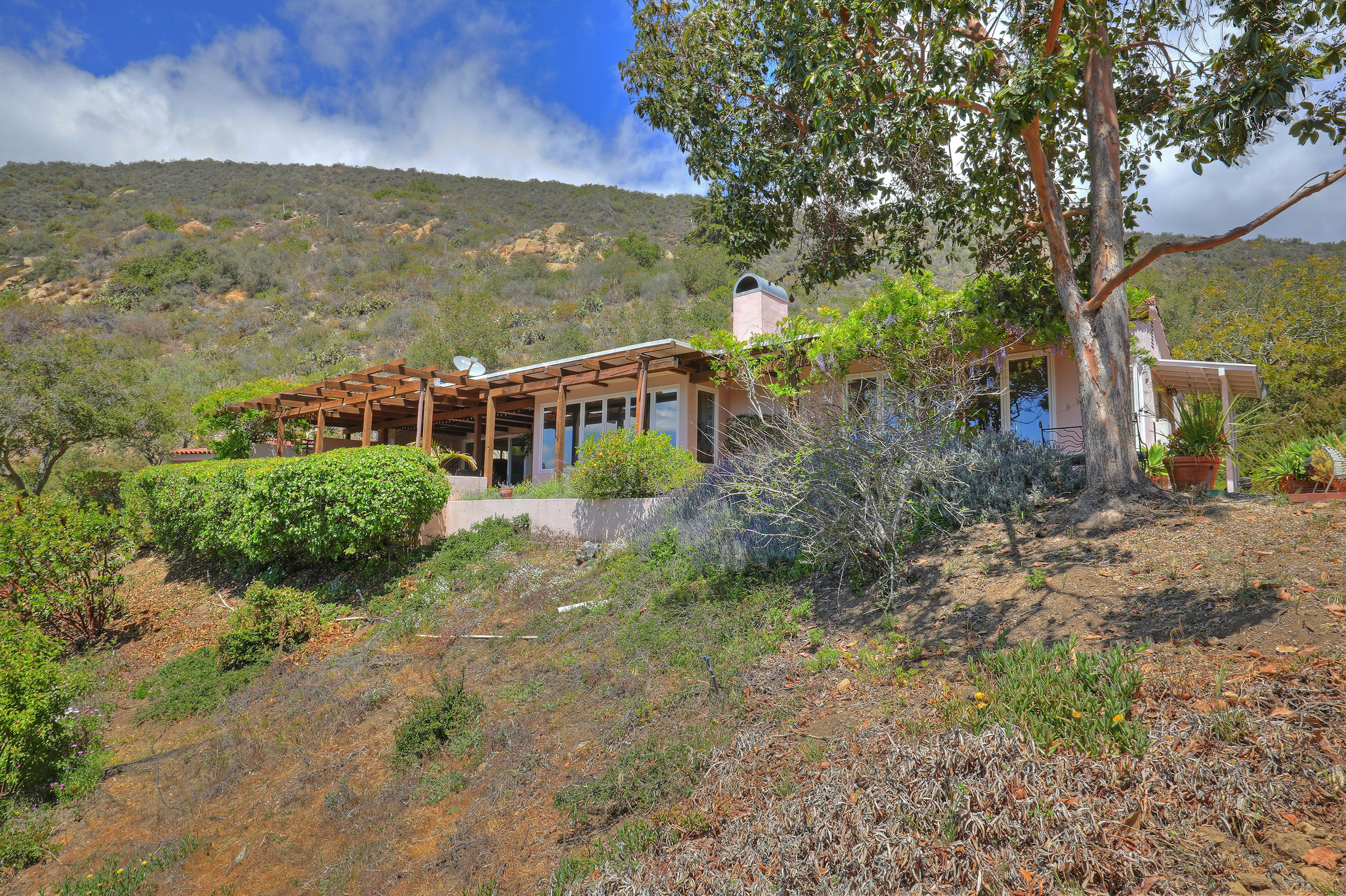 1986 Arriba Street Carpinteria, CA 93013 - Photo 3 of 35 a view of a houses with an outdoor space
