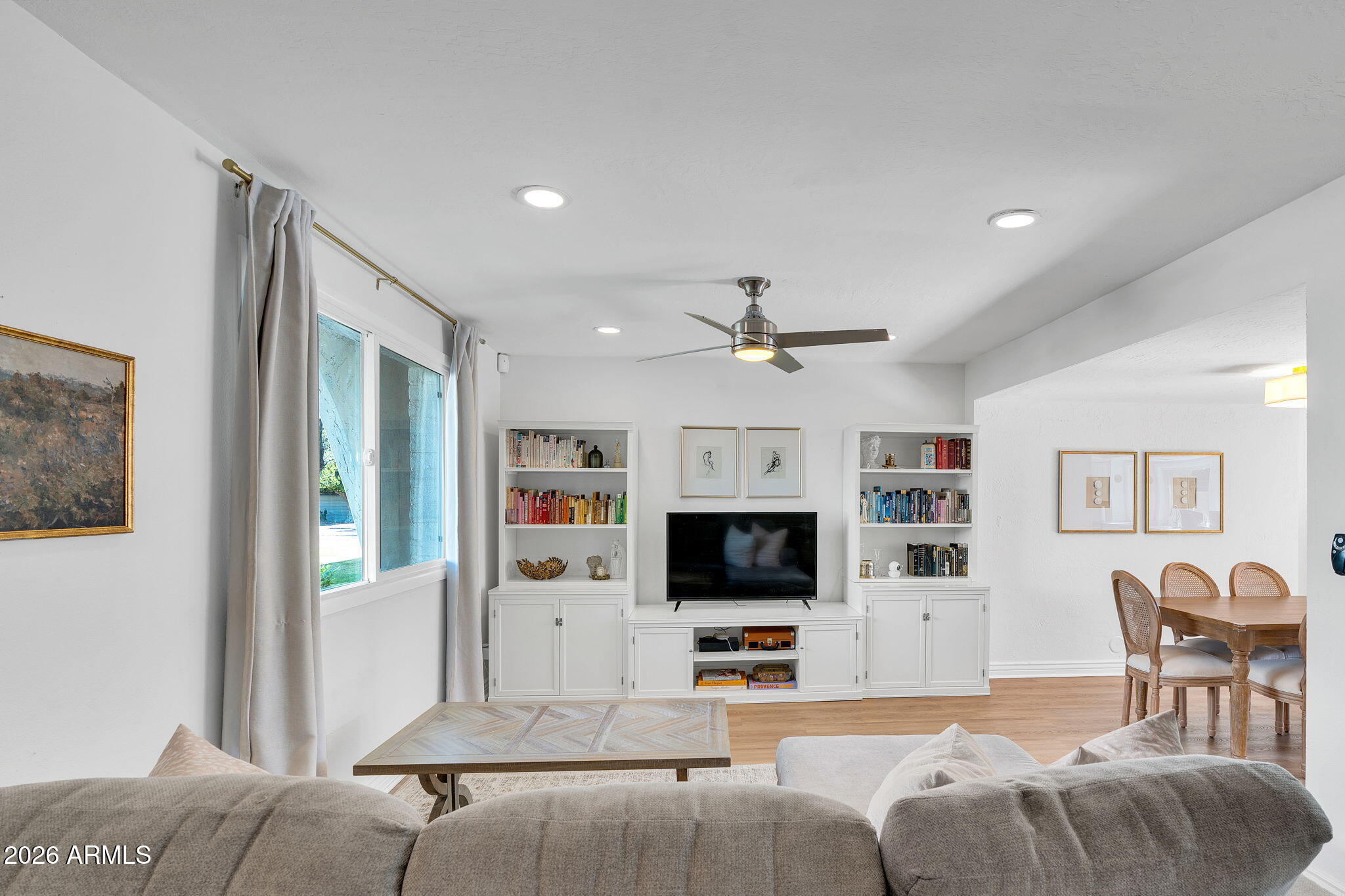 4217 North Miller Road Scottsdale, AZ 85251 - Photo 10 of 30 a living room with furniture and a flat screen tv