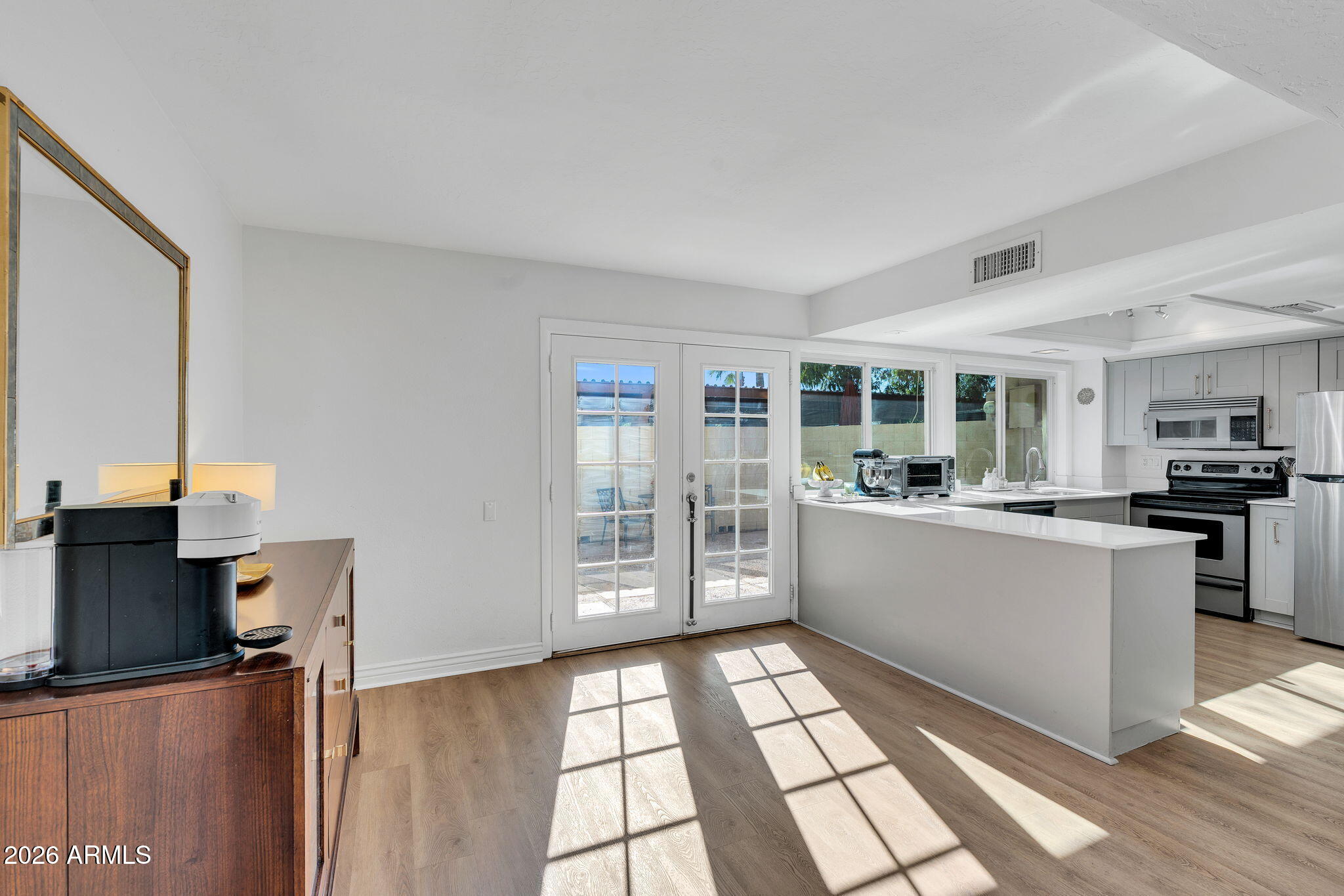 4217 North Miller Road Scottsdale, AZ 85251 - Photo 12 of 30 a kitchen with a sink and cabinets