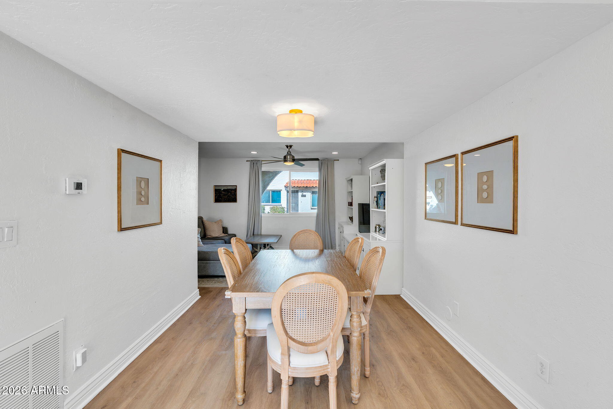 4217 North Miller Road Scottsdale, AZ 85251 - Photo 15 of 30 a dining room with furniture and wooden floor