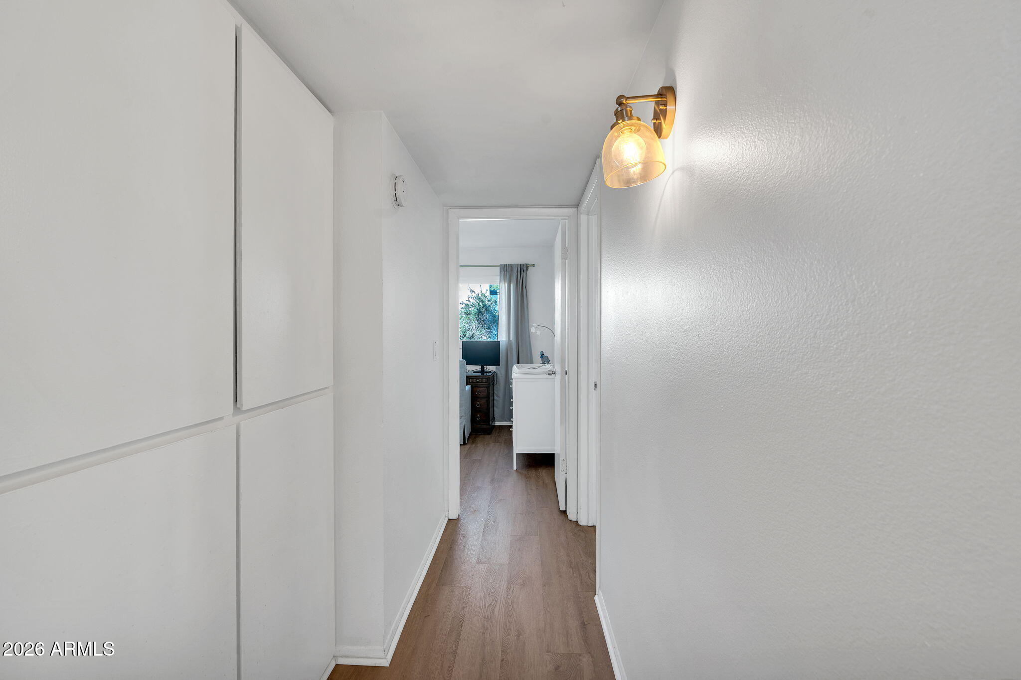 4217 North Miller Road Scottsdale, AZ 85251 - Photo 22 of 30 a view of a hallway with wooden floor