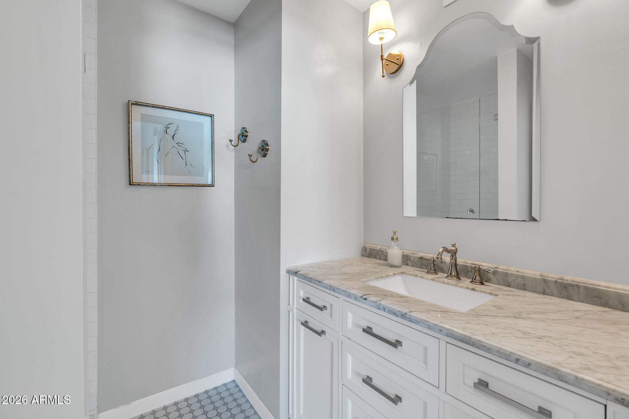 4217 North Miller Road Scottsdale, AZ 85251 - Photo 23 of 30 a bathroom with a granite countertop double vanity sink and a mirror