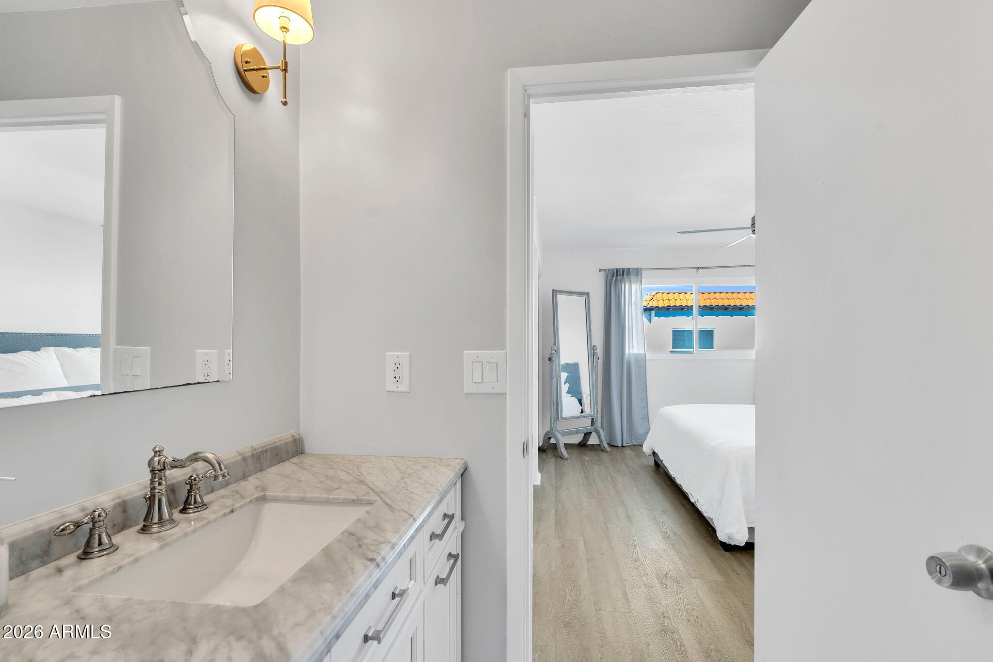 4217 North Miller Road Scottsdale, AZ 85251 - Photo 24 of 30 a bathroom with a sink vanity granite and a mirror