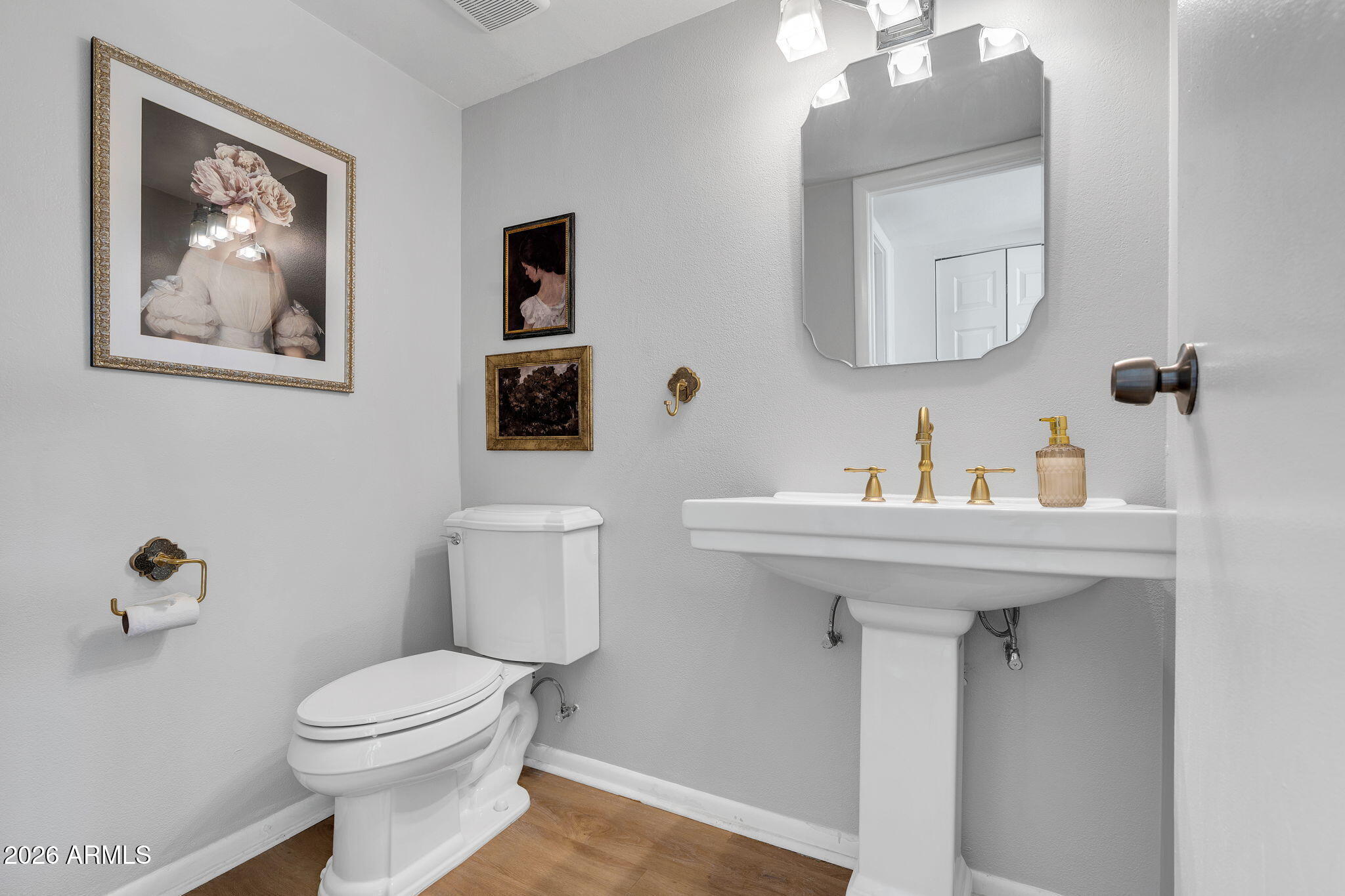 4217 North Miller Road Scottsdale, AZ 85251 - Photo 26 of 30 a bathroom with a toilet a sink and mirror