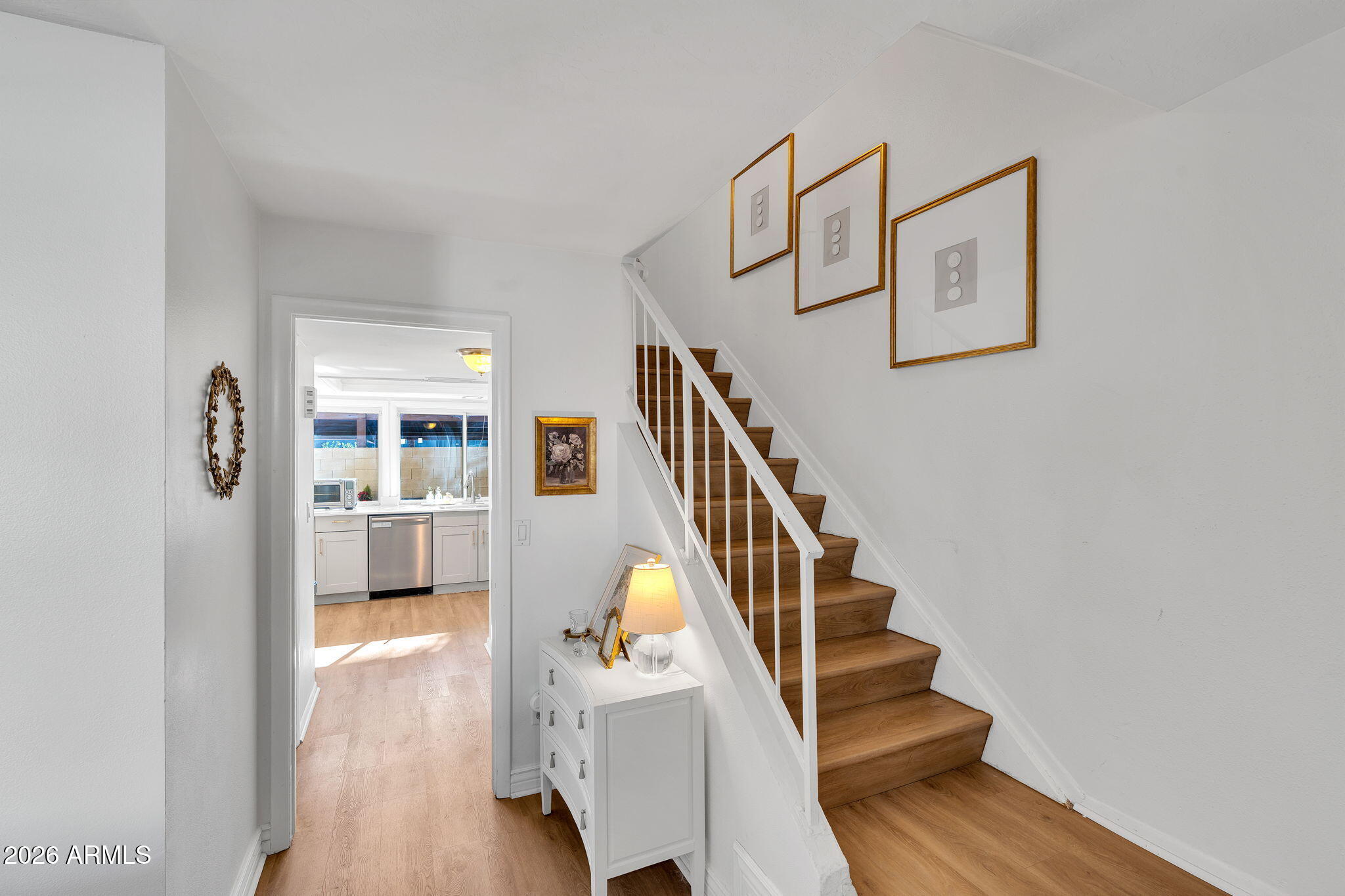 4217 North Miller Road Scottsdale, AZ 85251 - Photo 7 of 30 a view of entryway and hall with wooden floor