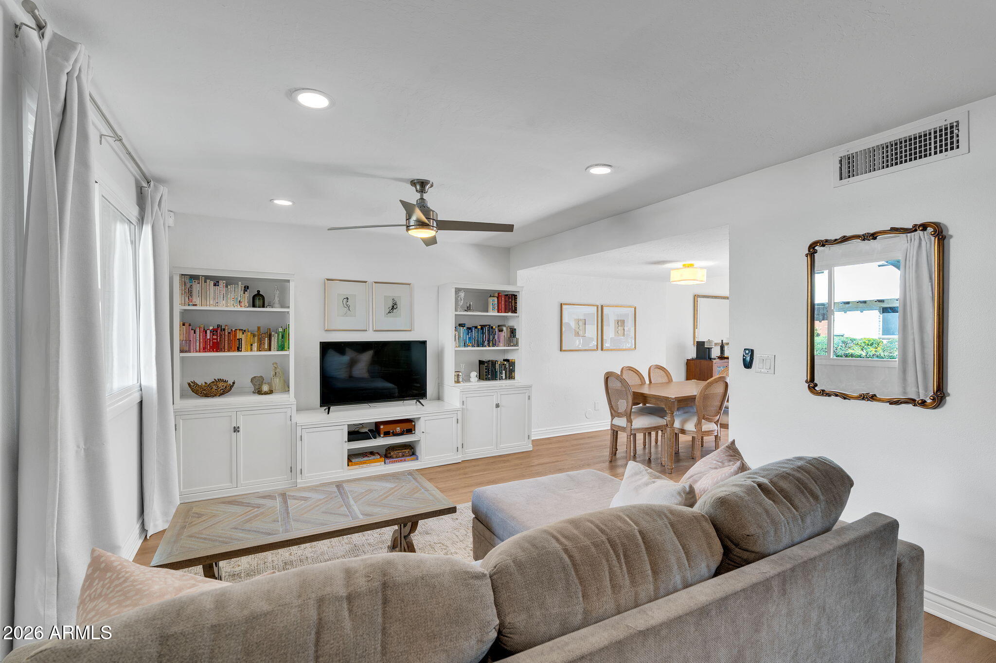 4217 North Miller Road Scottsdale, AZ 85251 - Photo 8 of 30 a living room with furniture and a flat screen tv