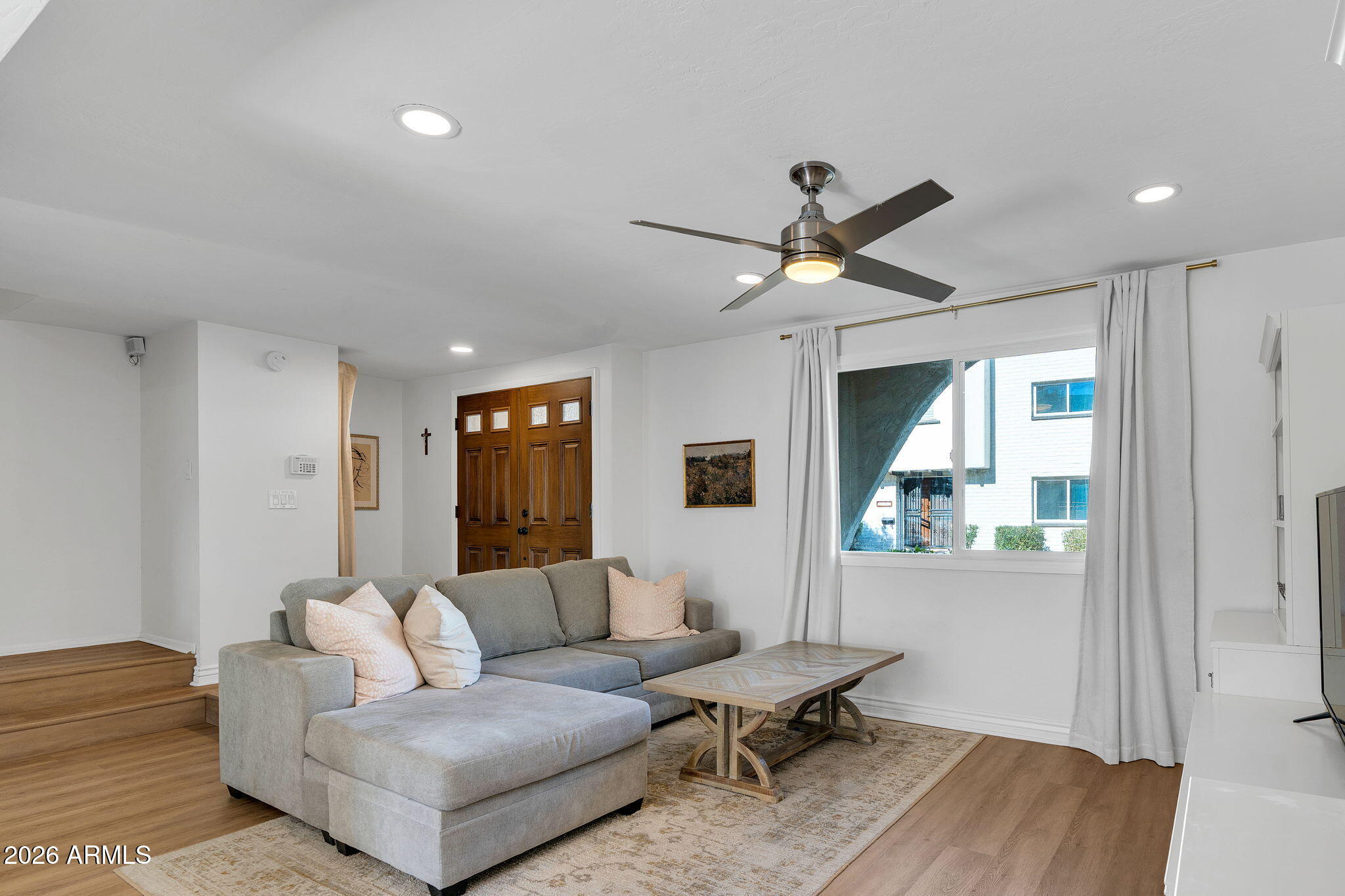 4217 North Miller Road Scottsdale, AZ 85251 - Photo 9 of 30 a living room with furniture and a large window