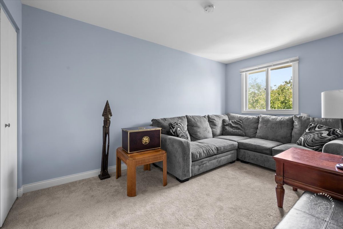 1015 Heathrow Court Wheaton, IL 60189 - Photo 16 of 18 a living room with furniture and a window