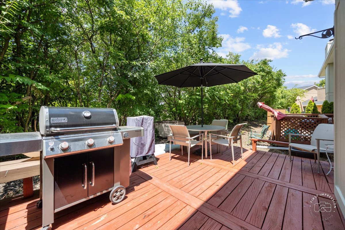 1015 Heathrow Court Wheaton, IL 60189 - Photo 17 of 18 a view of a chairs and table on the wooden roof deck