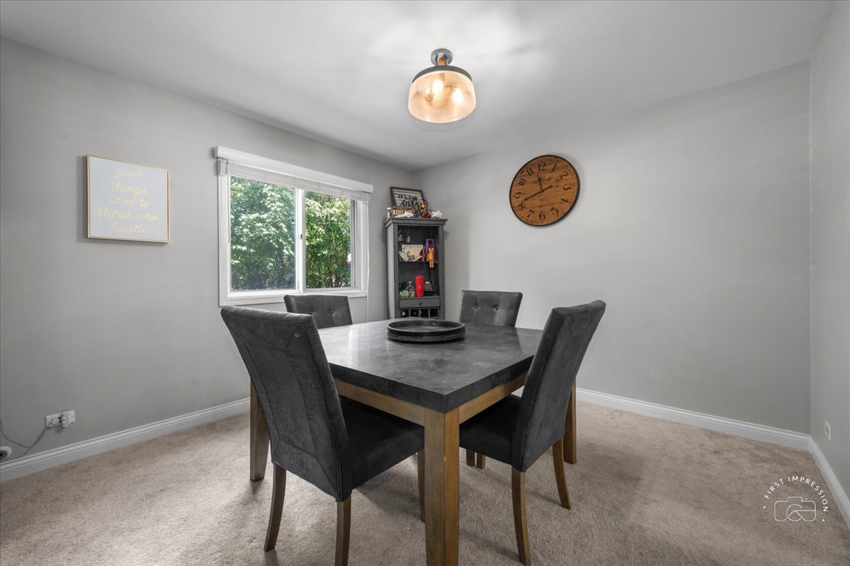 1015 Heathrow Court Wheaton, IL 60189 - Photo 10 of 18 a view of a dining room with a table and chairs