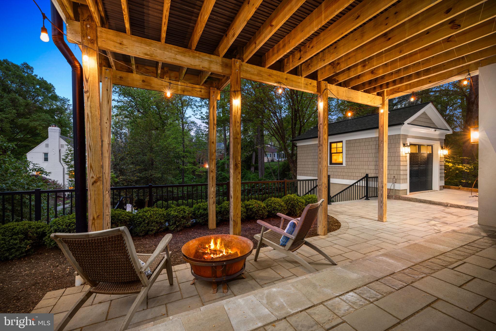 6517 Barnaby Street Northwest Washington, DC 20015 - Photo 14 of 20 a view of a patio with a dining table and chairs