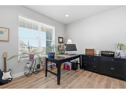 a workspace with furniture and window