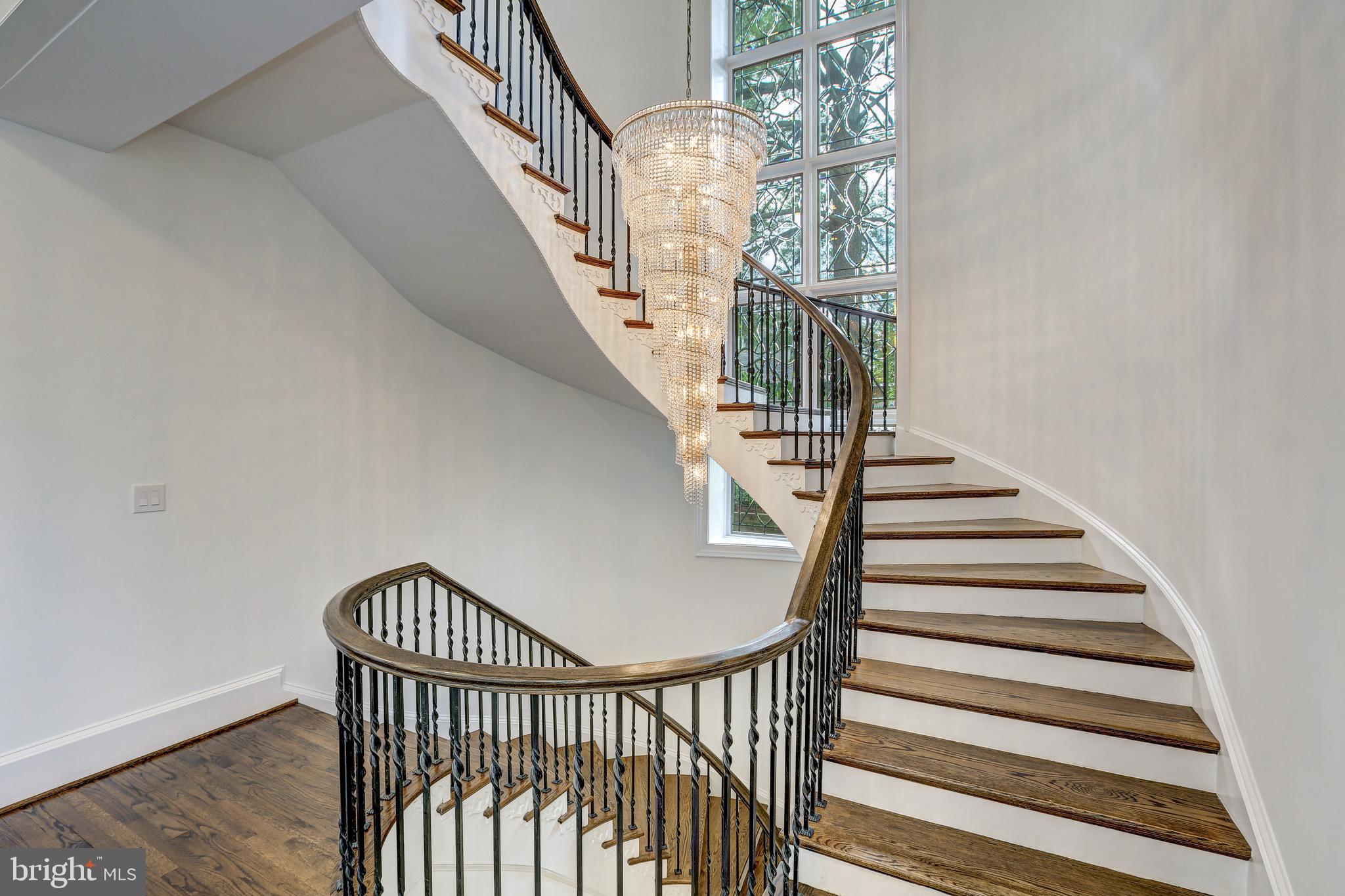 8313 Persimmon Tree Road Bethesda, MD 20817 - Photo 4 of 53 Curved Staircase & Crystal Chandelier