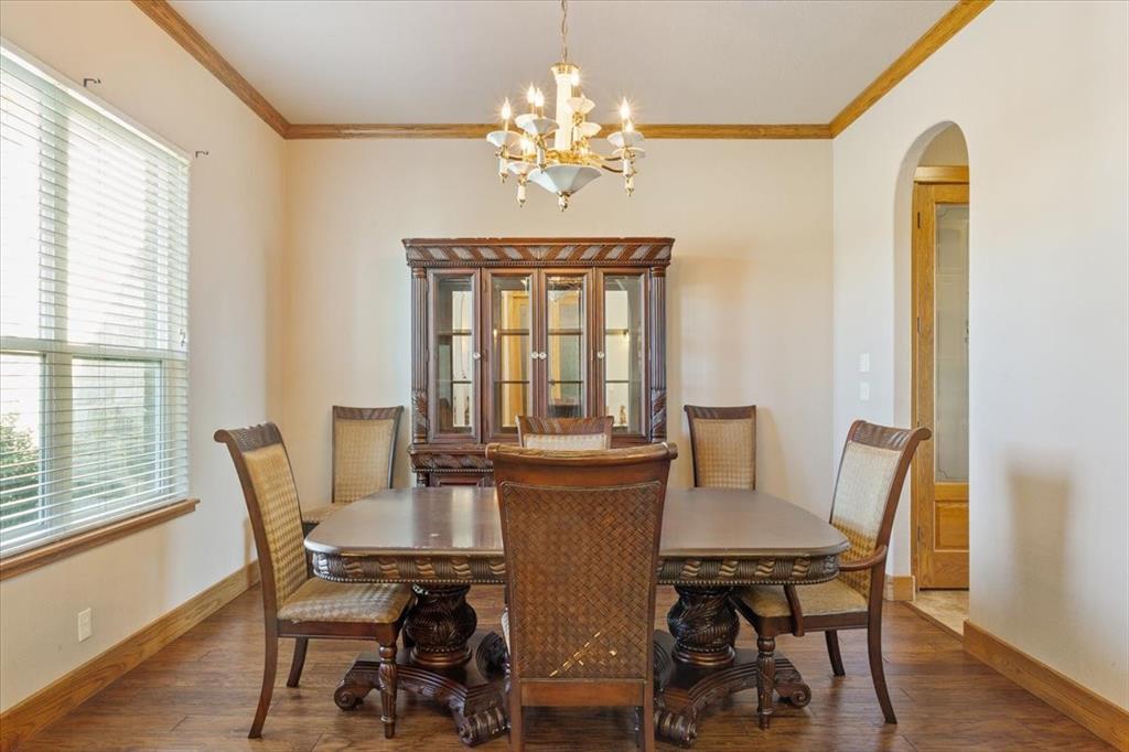 10479 Hartrick Bluff Road Little River-Academy, TX 76554 - Photo 11 of 40 a view of a dining room with furniture and wooden floor