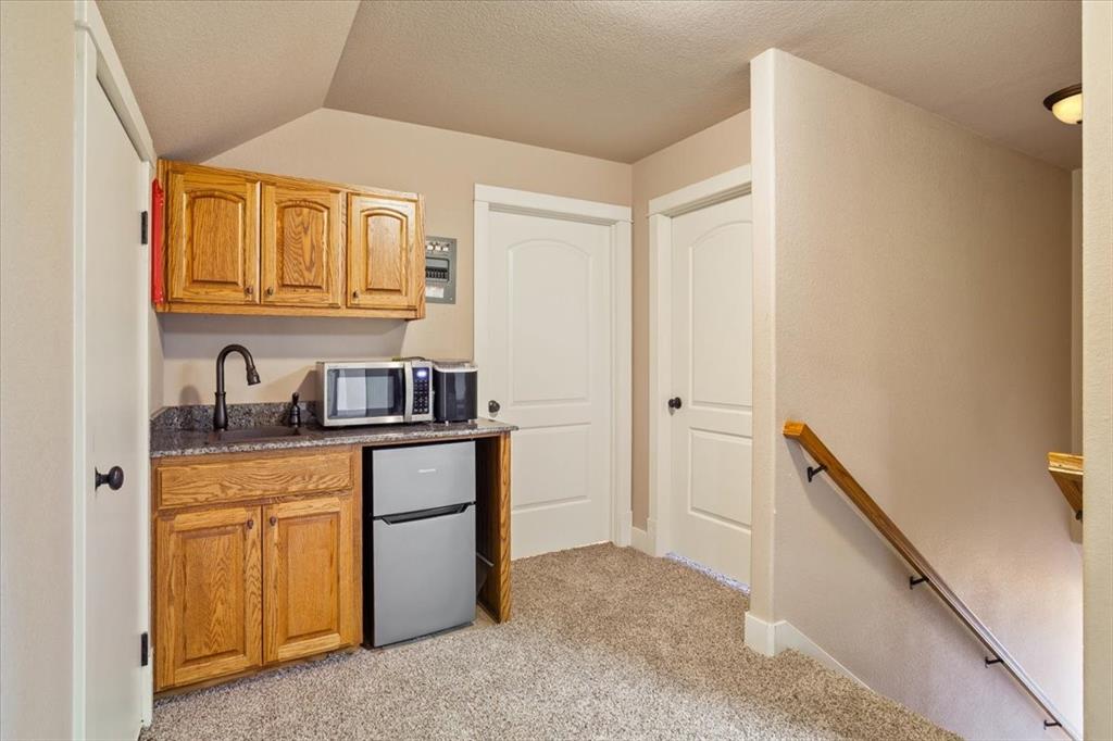 10479 Hartrick Bluff Road Little River-Academy, TX 76554 - Photo 25 of 40 a kitchen with stainless steel appliances granite countertop a refrigerator and a sink