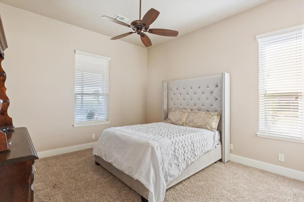 10479 Hartrick Bluff Road Little River-Academy, TX 76554 - Photo 28 of 40 a bedroom with a large bed and a window