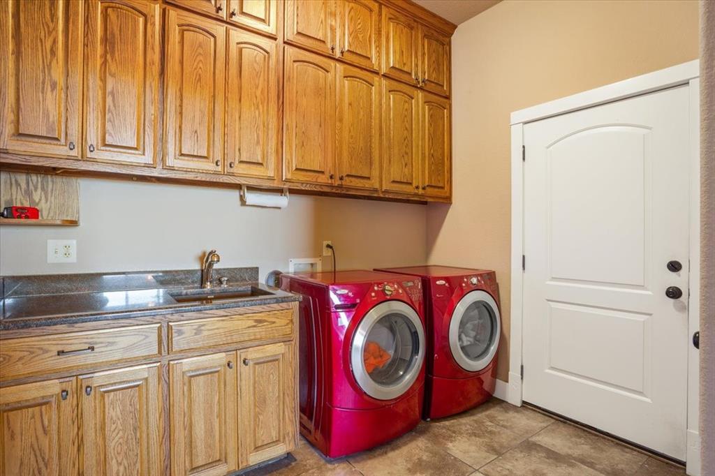 10479 Hartrick Bluff Road Little River-Academy, TX 76554 - Photo 34 of 40 a utility room with sink dryer and washer