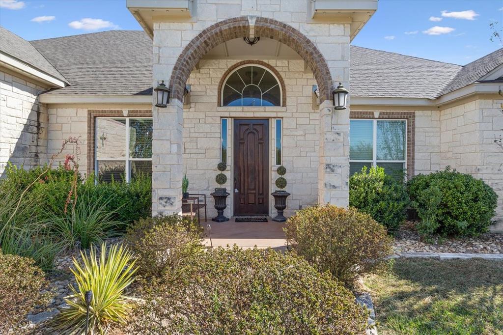 10479 Hartrick Bluff Road Little River-Academy, TX 76554 - Photo 8 of 40 a front view of a house with a garden