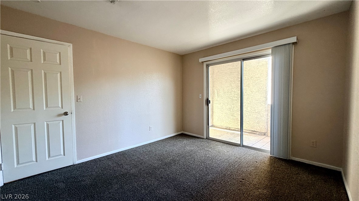 6250 West Flamingo Road, Unit 4 Las Vegas, NV 89103 - Photo 27 of 45 This cozy room offers convenient access to outdoor space through sliding glass doors.