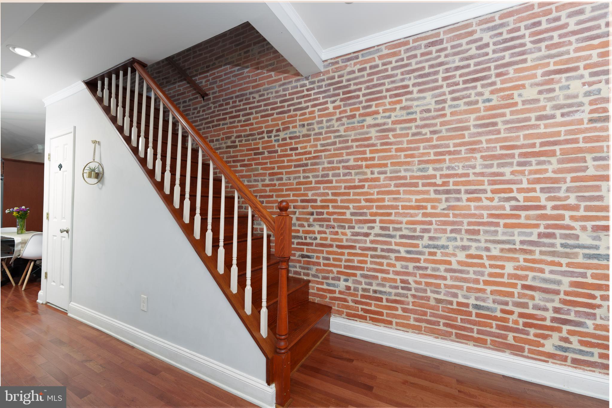 1246 William Street Baltimore, MD 21230 - Photo 11 of 45 Exposed brick and stairs to second floor