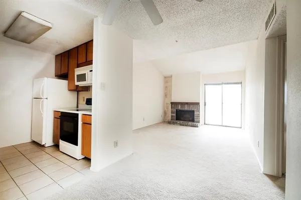 a view of kitchen and hallway with workspace