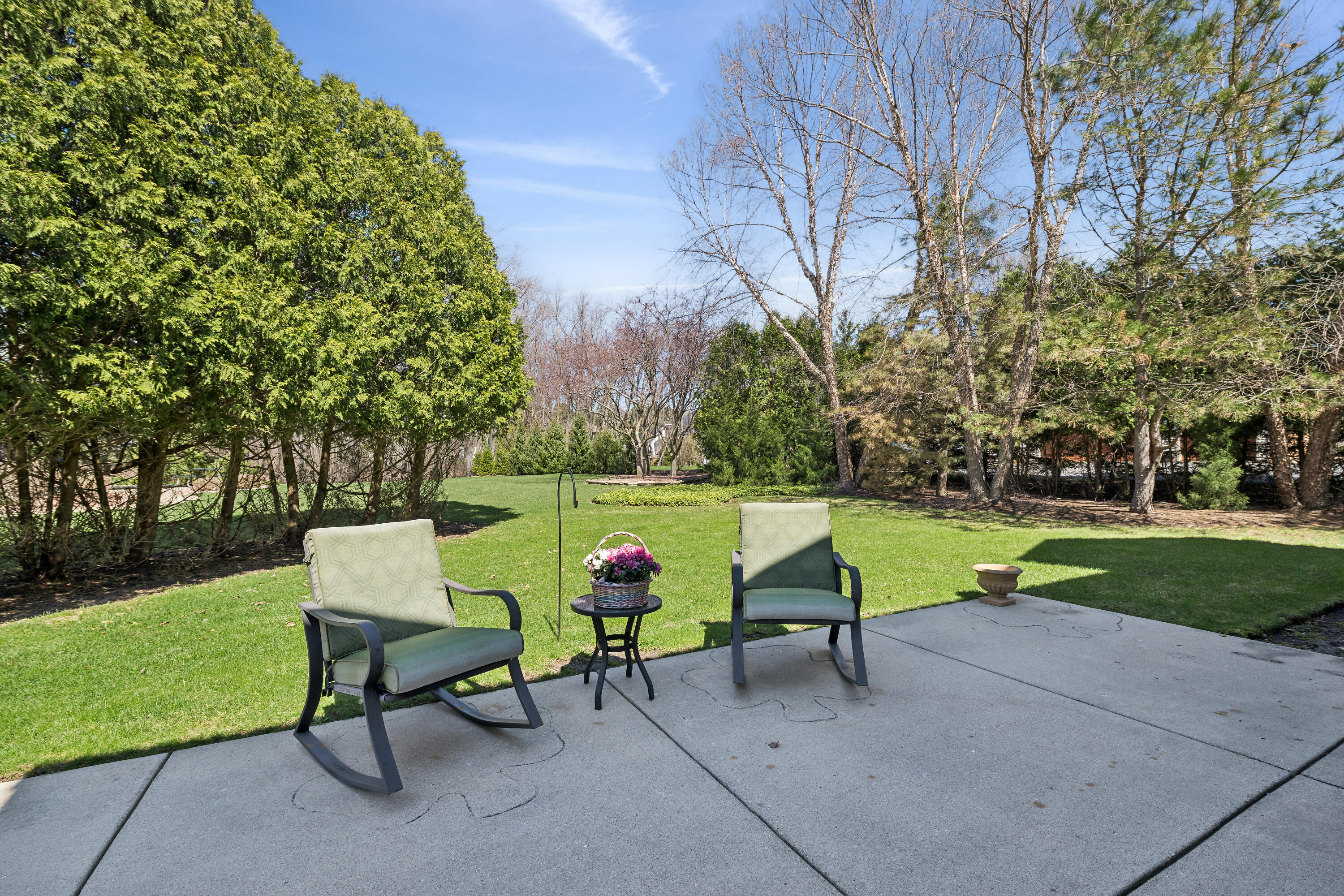 538 Pheasant Ridge Lane Fontana, WI 53125 - Photo 22 of 23 Patio w/wooded views of nature