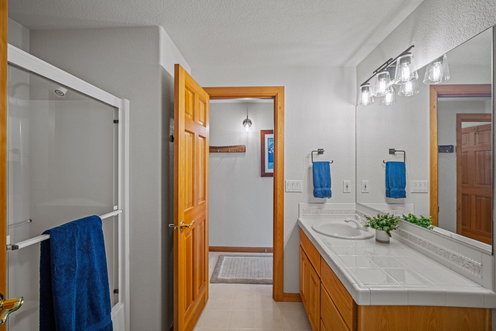 17948 Shadow Lane, Unit 7 Sunriver, OR 97707 - Photo 54 of 92 a bathroom with a granite countertop sink and a mirror