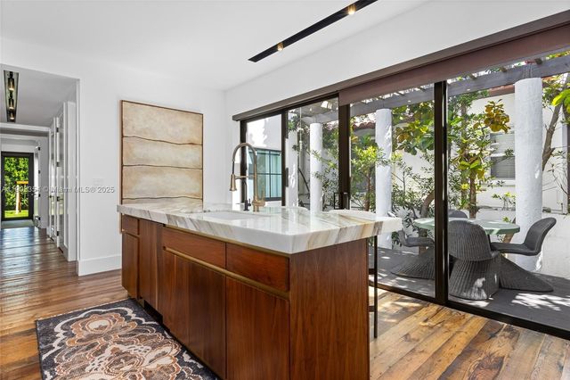 a bedroom with a bed and a wooden floor