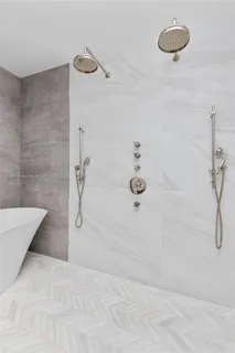 a bedroom with a large bed and a couch