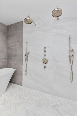 a bedroom with a large bed and a couch