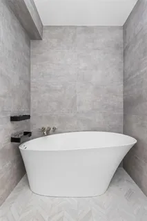 a kitchen with white cabinets and a sink