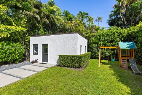 a view of a backyard with a garden and plants