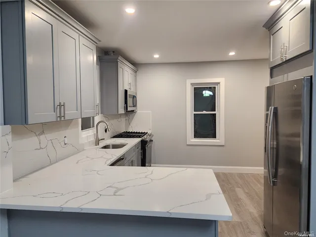 a large white bed in a white room